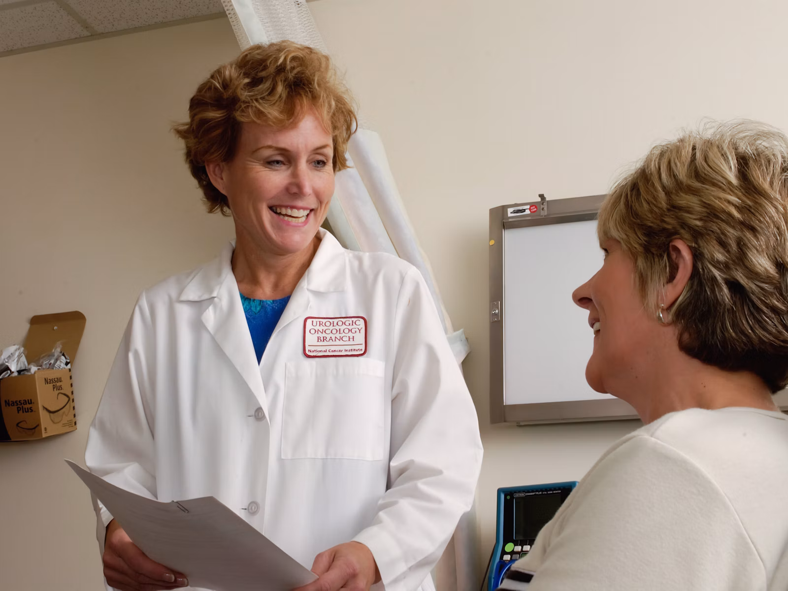Clinician discussing laser pain therapy